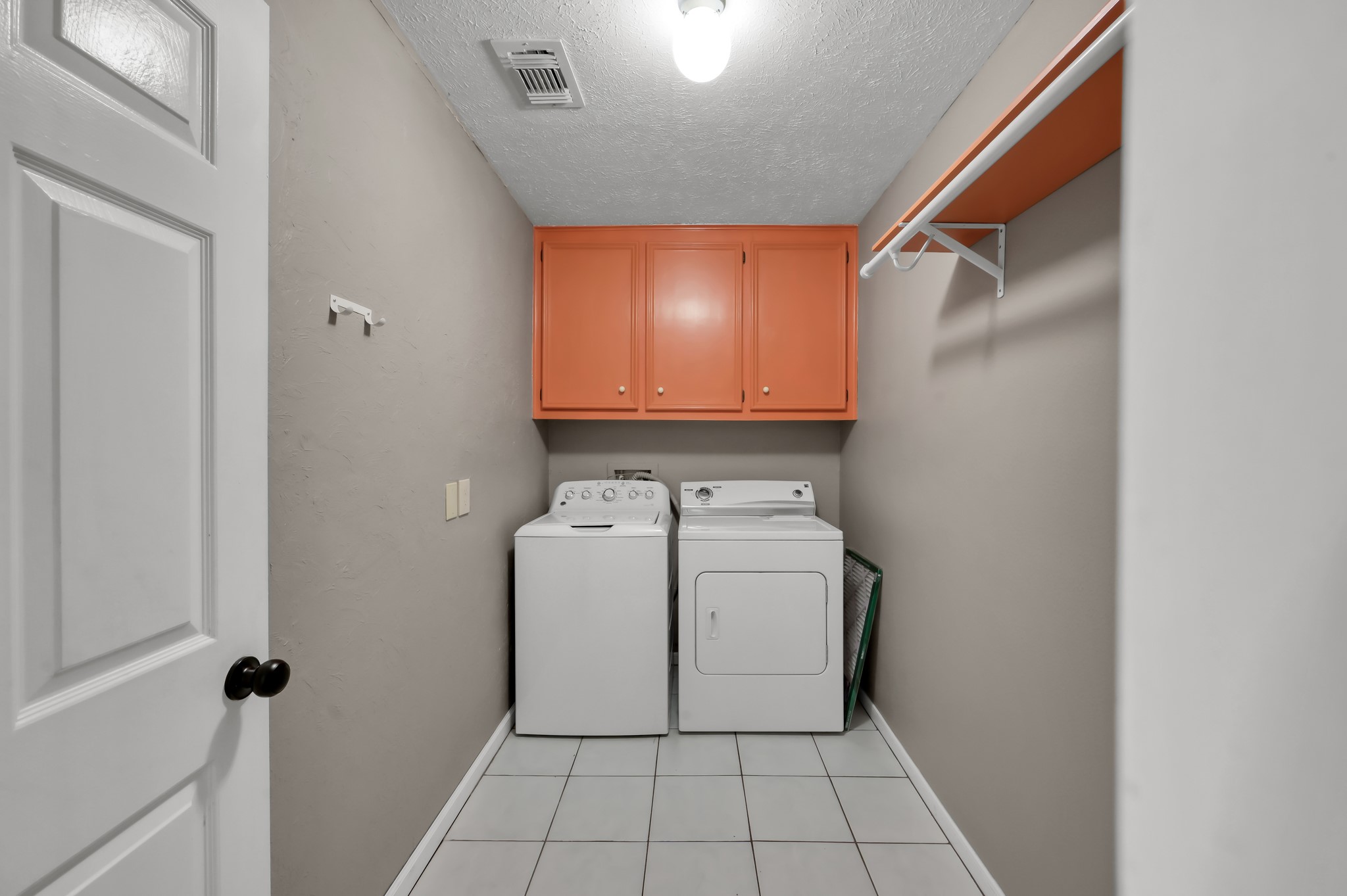 16135 Ridge Park Drive Houston, TX 77095 - Photo 21 of 27 Built in storage in laundry room. Washer and dryer stay with the home.