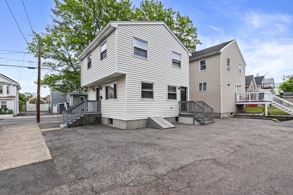 23 Logan Street Lynn, MA 01902 - Photo 5 of 27 a view of a house with backyard