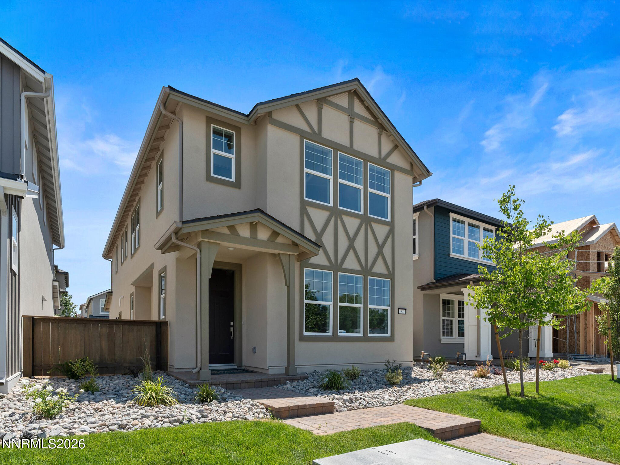 1371 Vine Gate Road, Unit HOMESITE 49 Carson City, NV 89701 - Photo 2 of 24 a front view of a house with garden