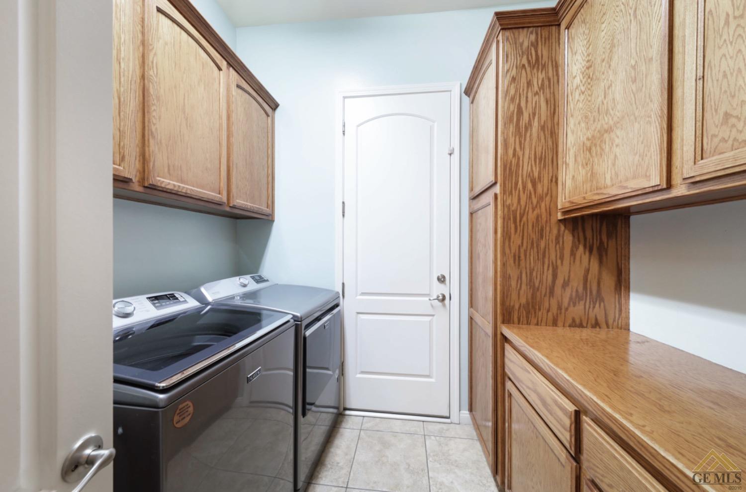 Undisclosed Address Bakersfield, CA 93314 - Photo 25 of 31 a kitchen with stainless steel appliances granite countertop a sink and a refrigerator