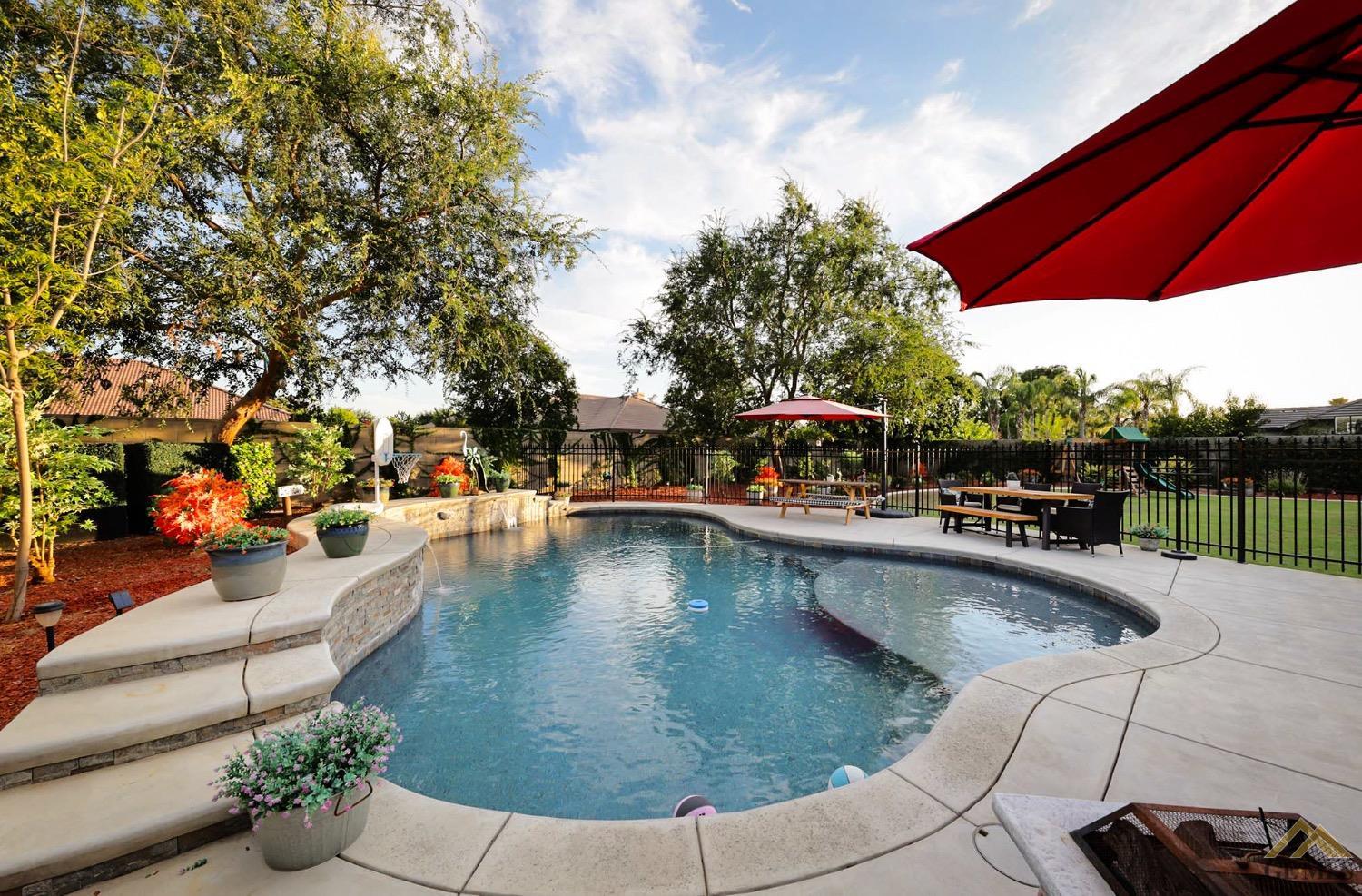Undisclosed Address Bakersfield, CA 93314 - Photo 27 of 31 a view of a swimming pool with a patio