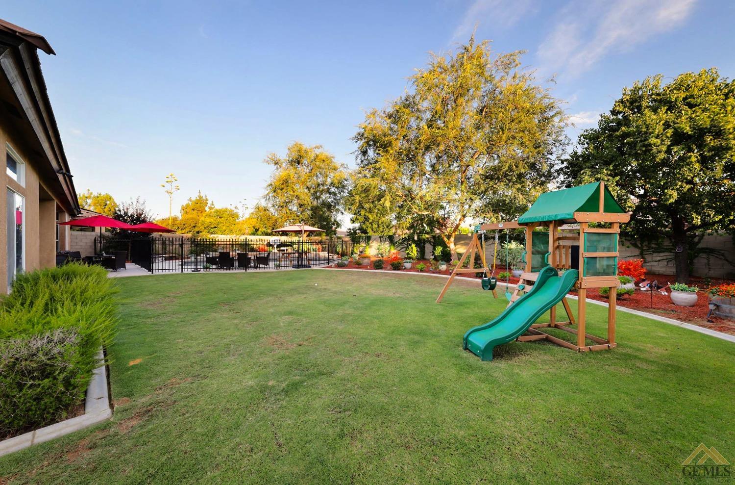 Undisclosed Address Bakersfield, CA 93314 - Photo 28 of 31 a childrens park with lots of swings and slides
