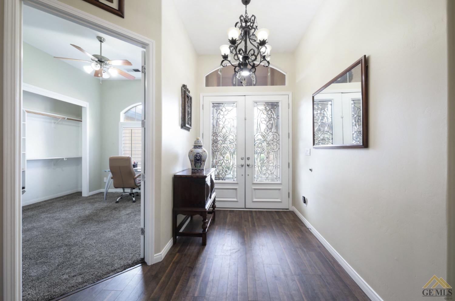 Undisclosed Address Bakersfield, CA 93314 - Photo 5 of 31 wooden floor in an empty room with a mirror