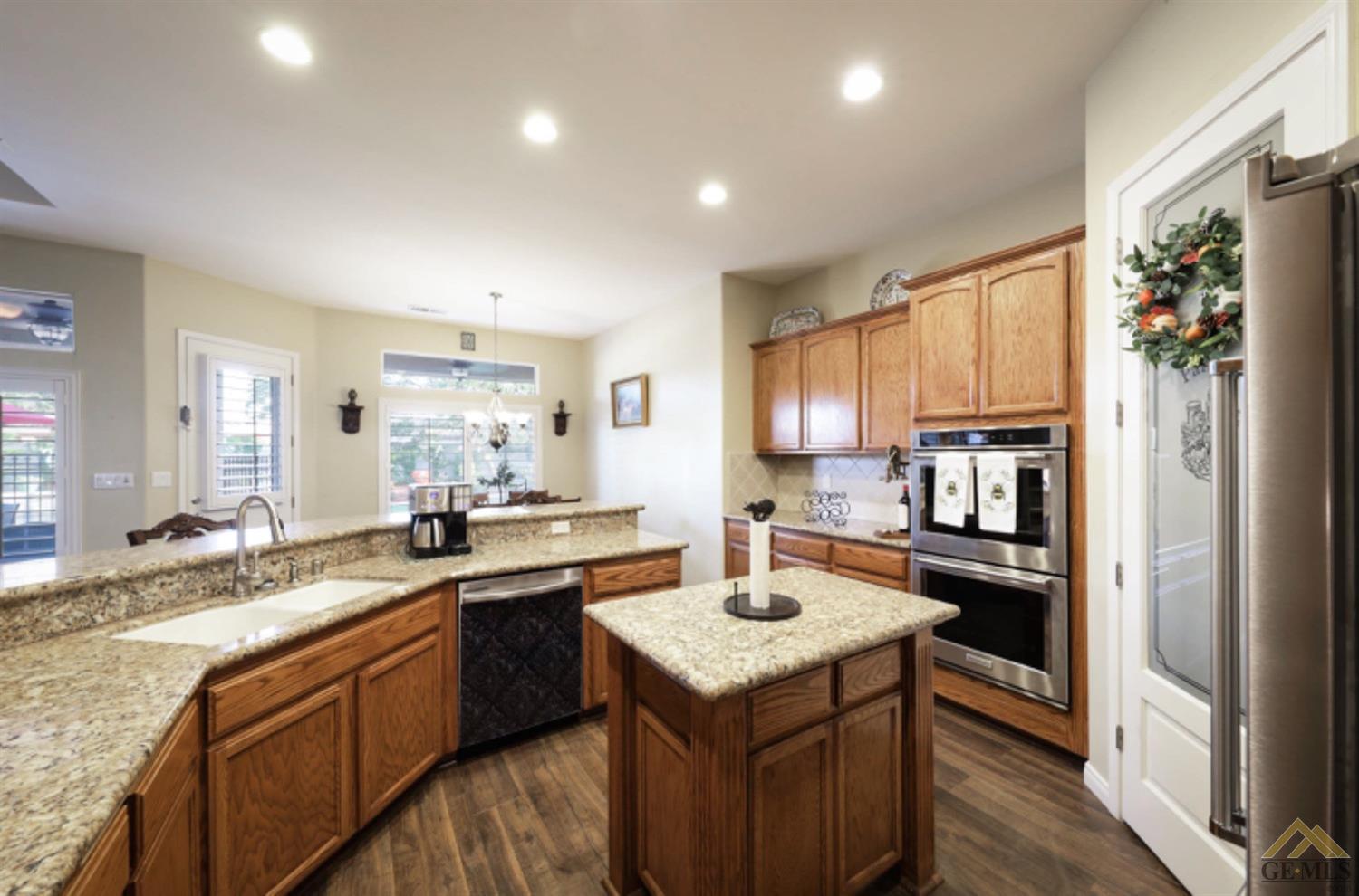 Undisclosed Address Bakersfield, CA 93314 - Photo 7 of 31 a kitchen with a sink stove and refrigerator