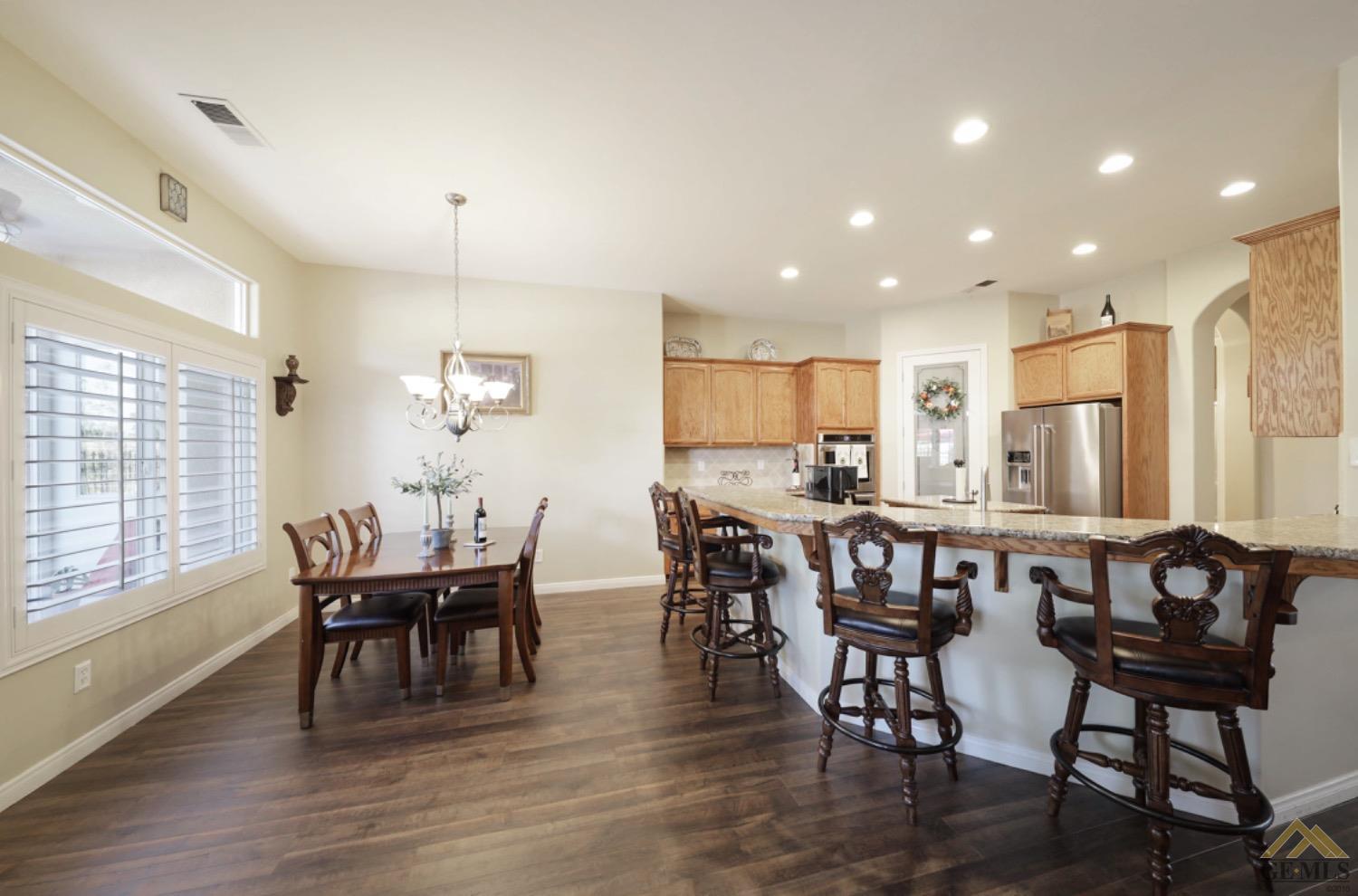 Undisclosed Address Bakersfield, CA 93314 - Photo 9 of 31 a view of a dining room with furniture window and wooden floor