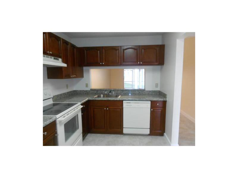 9853 Three Lakes Circle, Unit 2B Boca Raton, FL 33428 - Photo 5 of 6 ROSEWOOD KITCHEN VIEW