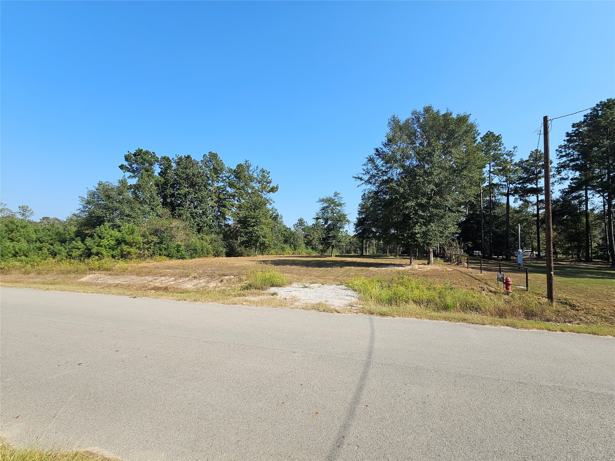 417 County Road 3773 Cleveland, TX 77327 - Photo 11 of 11 a view of ocean with large trees