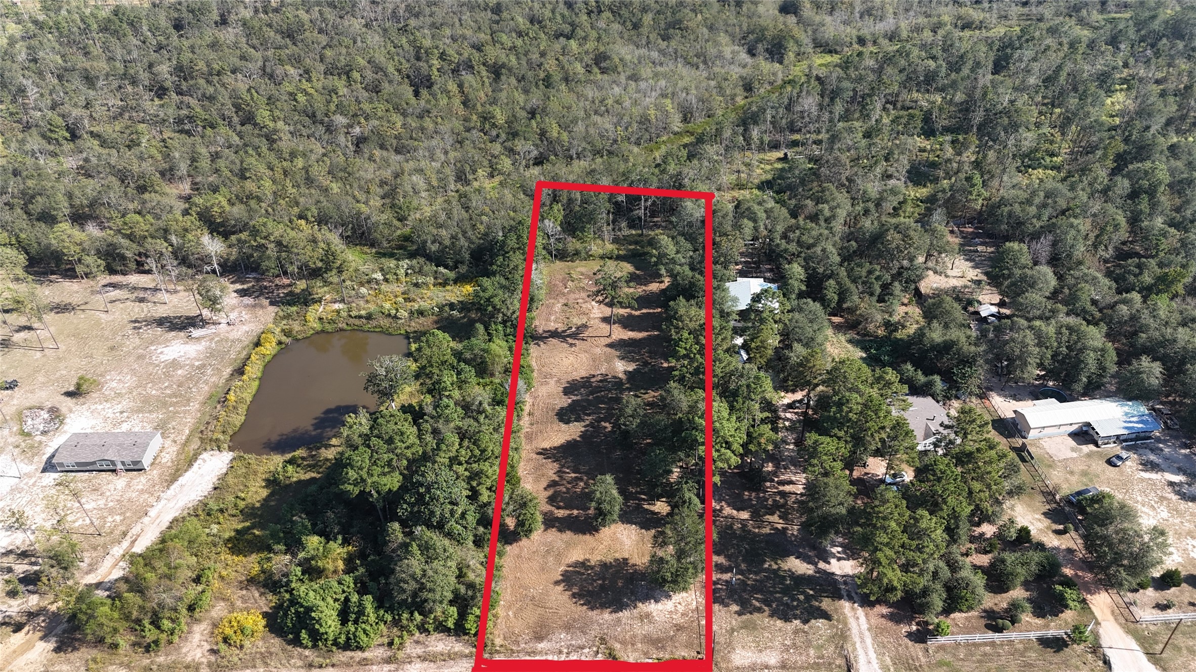 417 County Road 3773 Cleveland, TX 77327 - Photo 2 of 11 a picture of trees