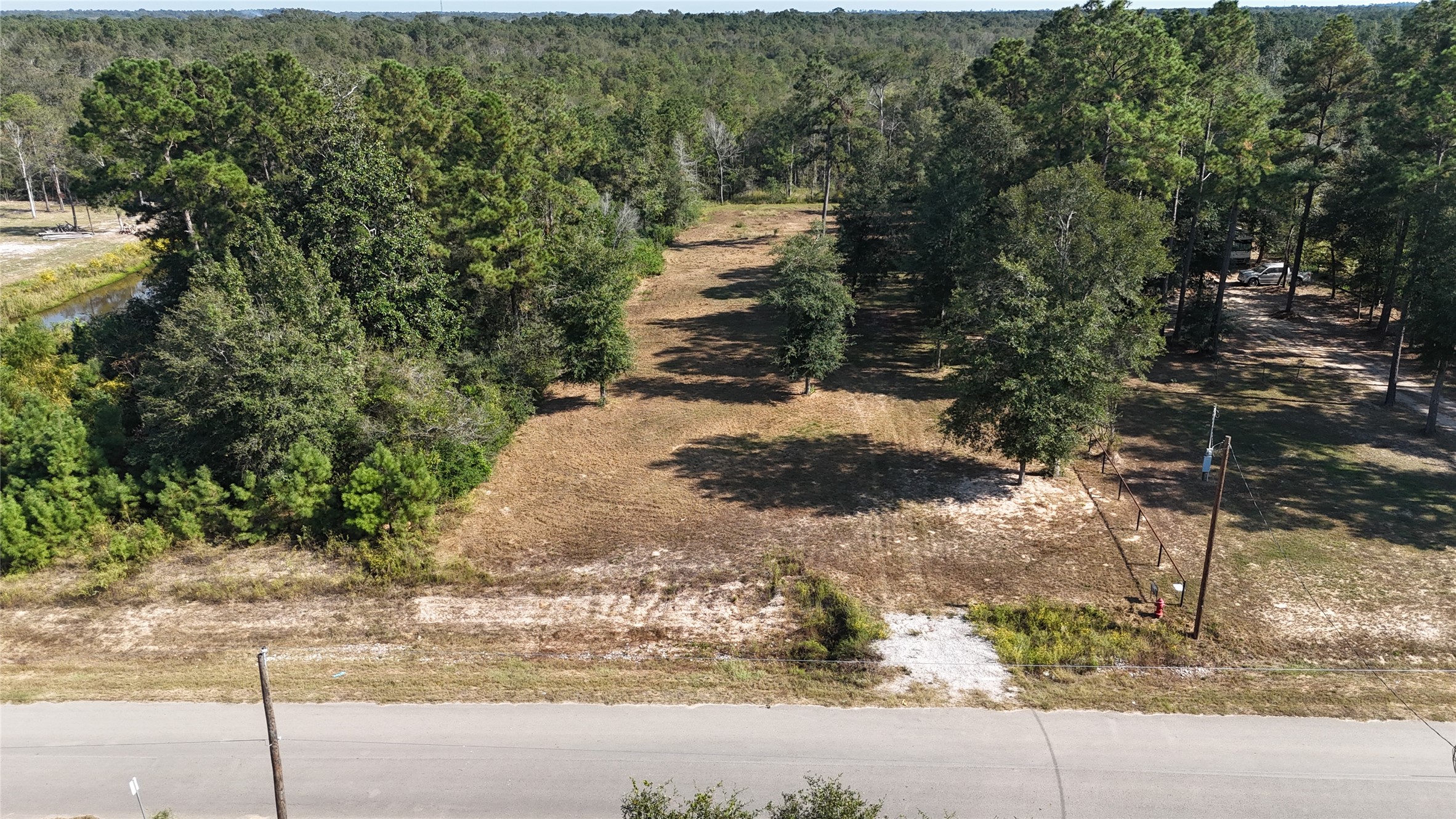 417 County Road 3773 Cleveland, TX 77327 - Photo 9 of 11 a view of a pathway both side of yard