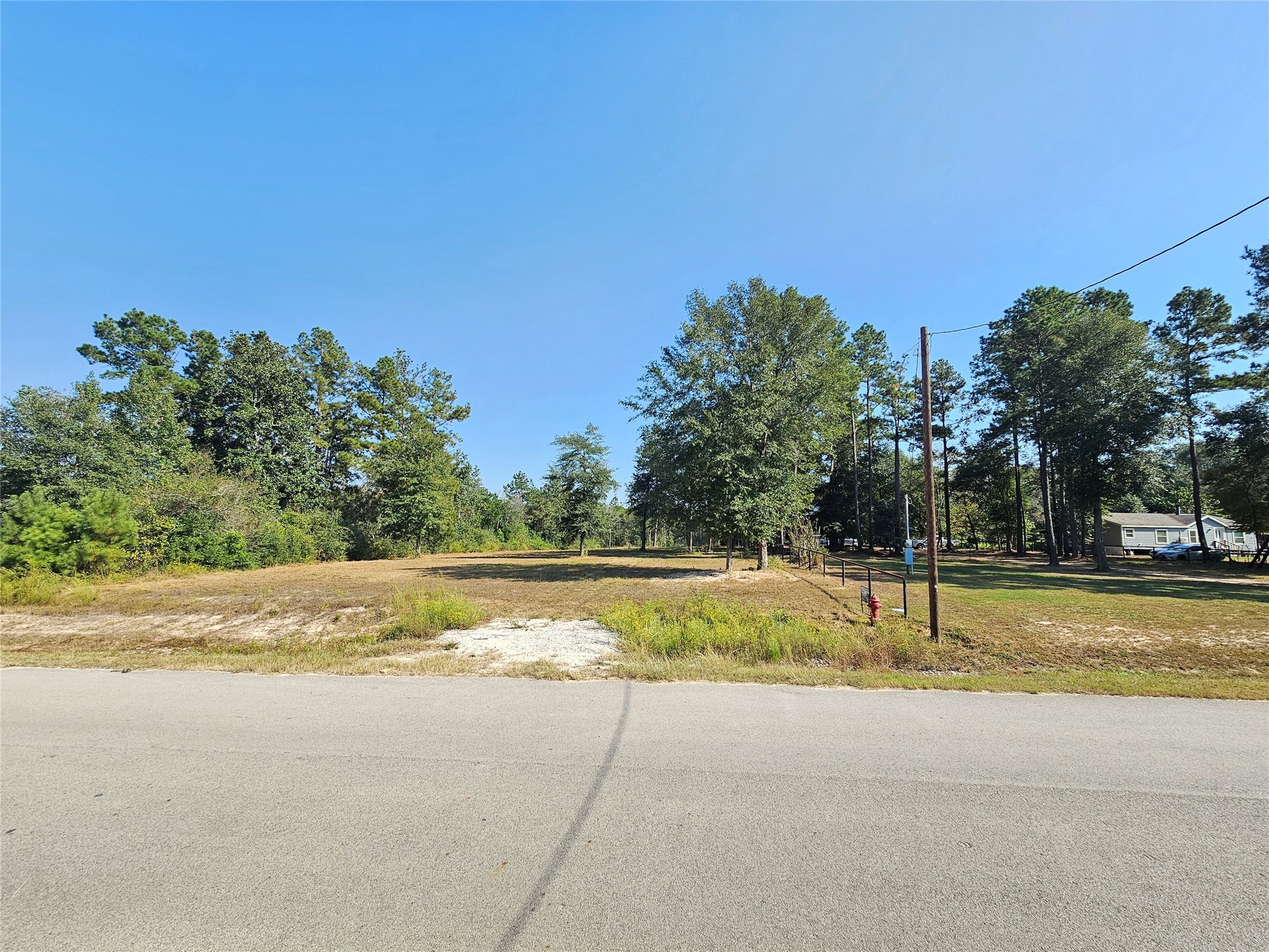 417 County Road 3773 Cleveland, TX 77327 - Photo 10 of 11 a view of a swimming pool with an outdoor space and seating area