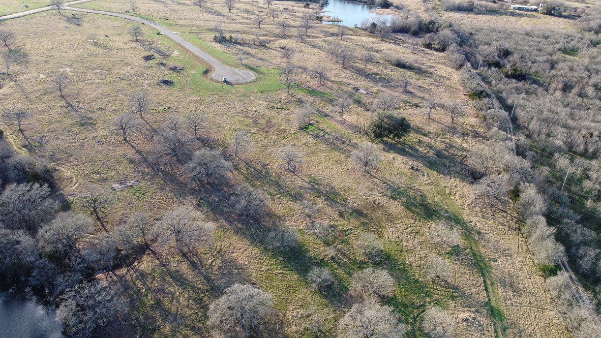 Tbd Tbd New Moon Court Red Rock, TX 78662 - Photo 9 of 19 a view of a dry yard with lots of bushes