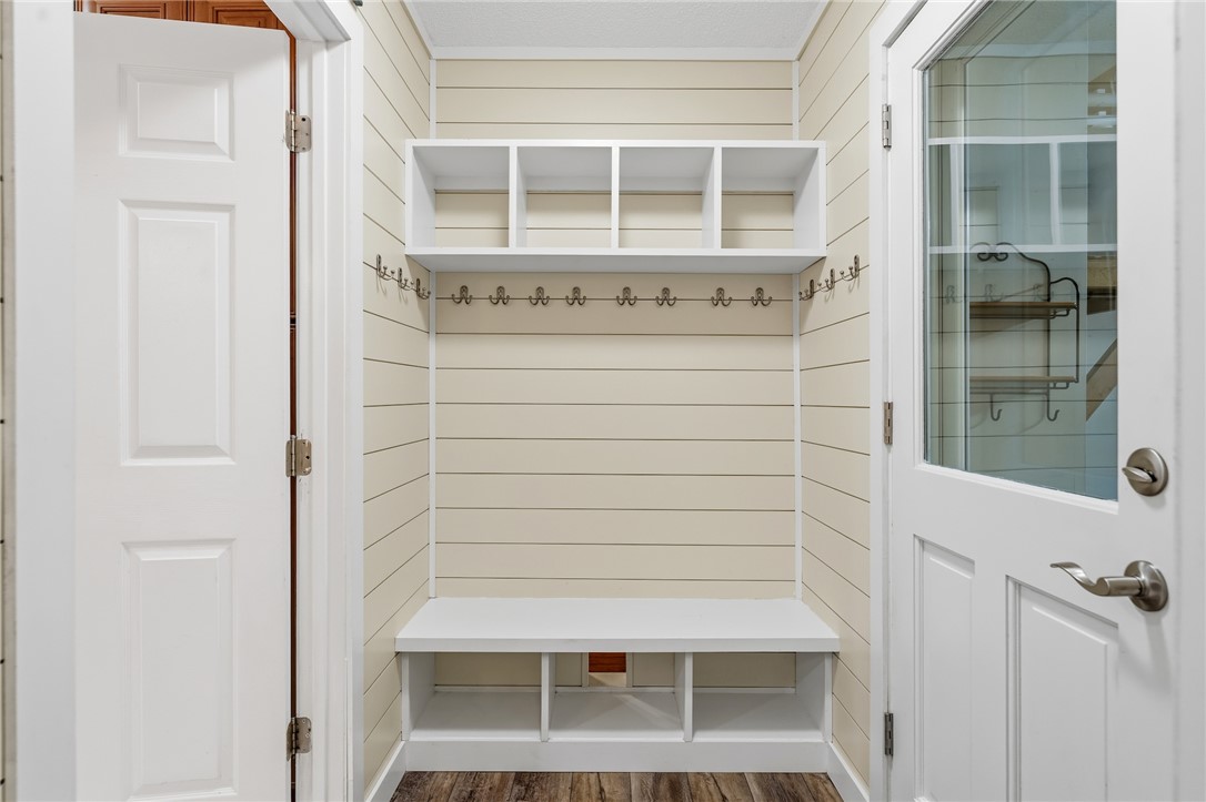 1014 East Queen Street Pendleton, SC 29670 - Photo 16 of 43 A convenient mudroom entry offers built-in storage cubbies, a bench, and a coat rack for organized living.