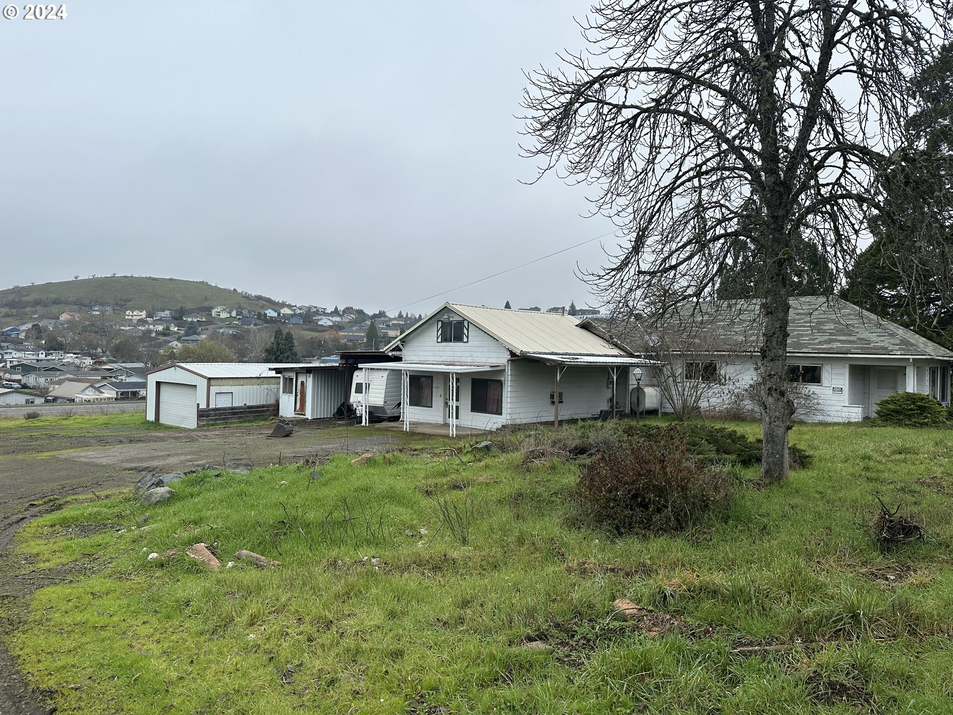 5114 Southwest Grange Road Roseburg, OR 97471 - Photo 1 of 11 a view of a yard in front of the house
