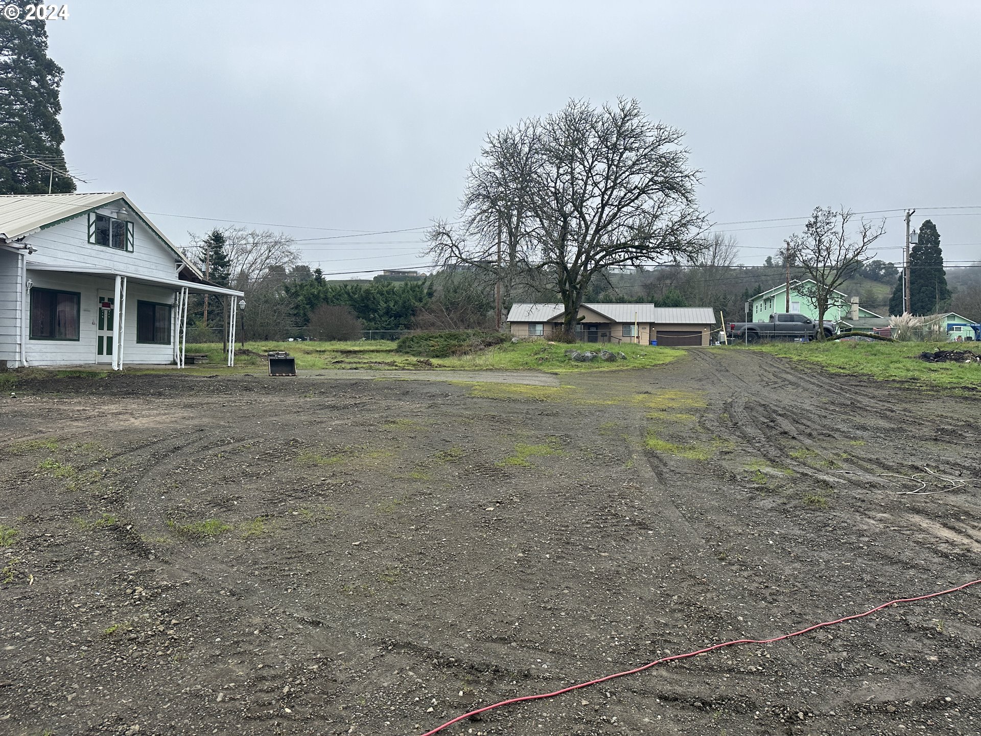 5114 Southwest Grange Road Roseburg, OR 97471 - Photo 3 of 11 a view of a house with a yard