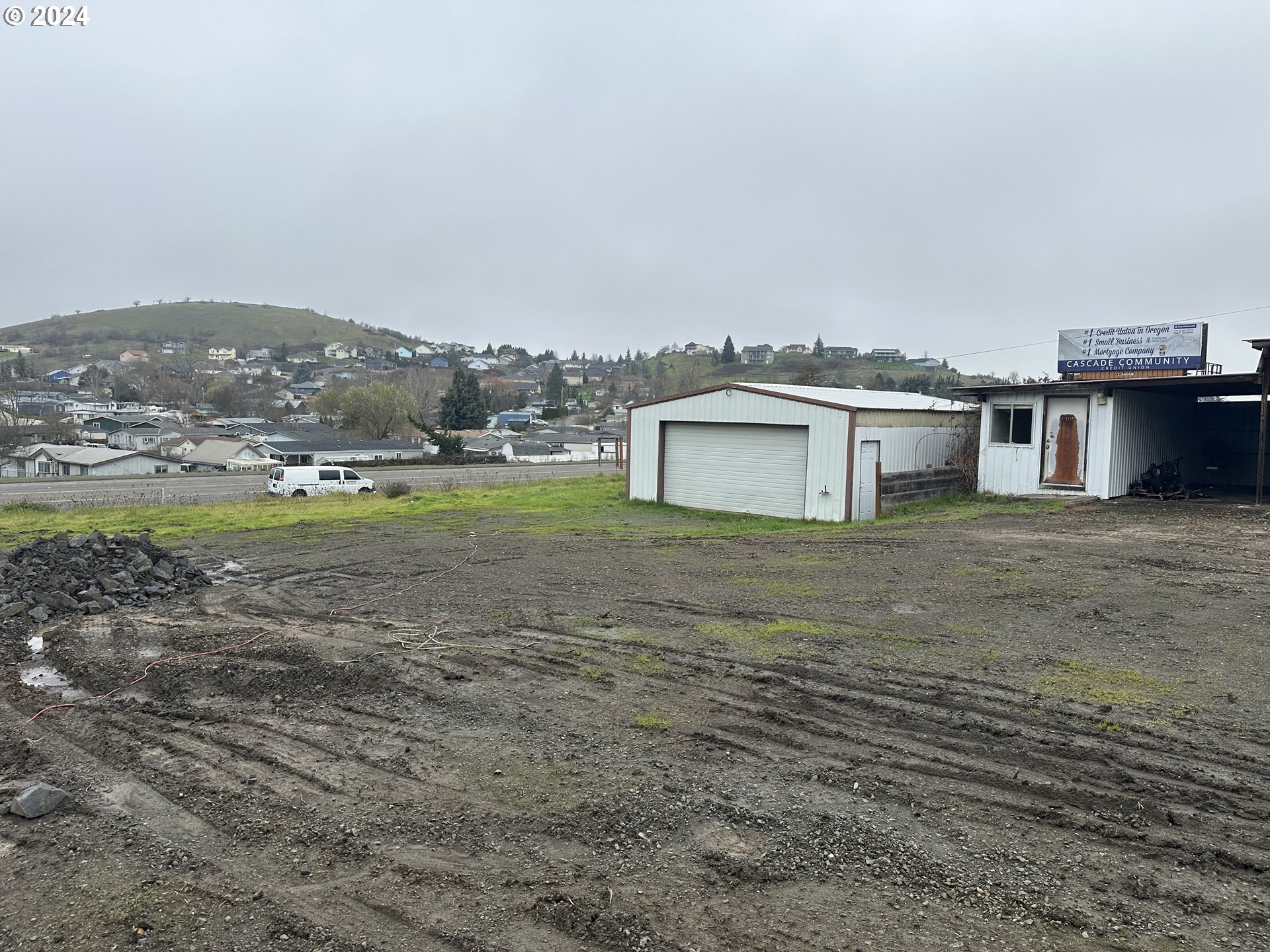 5114 Southwest Grange Road Roseburg, OR 97471 - Photo 6 of 11 a view of a big house with a big yard