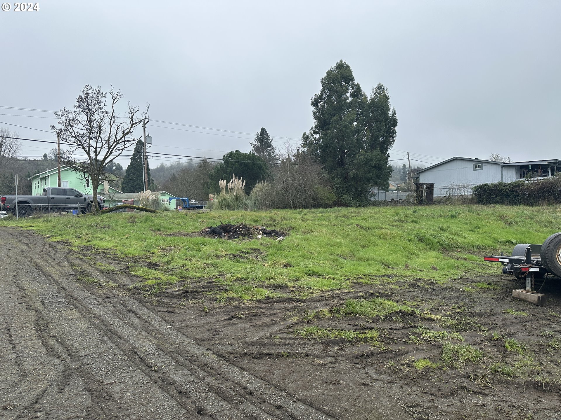 5114 Southwest Grange Road Roseburg, OR 97471 - Photo 8 of 11 a view of a grassy field with trees