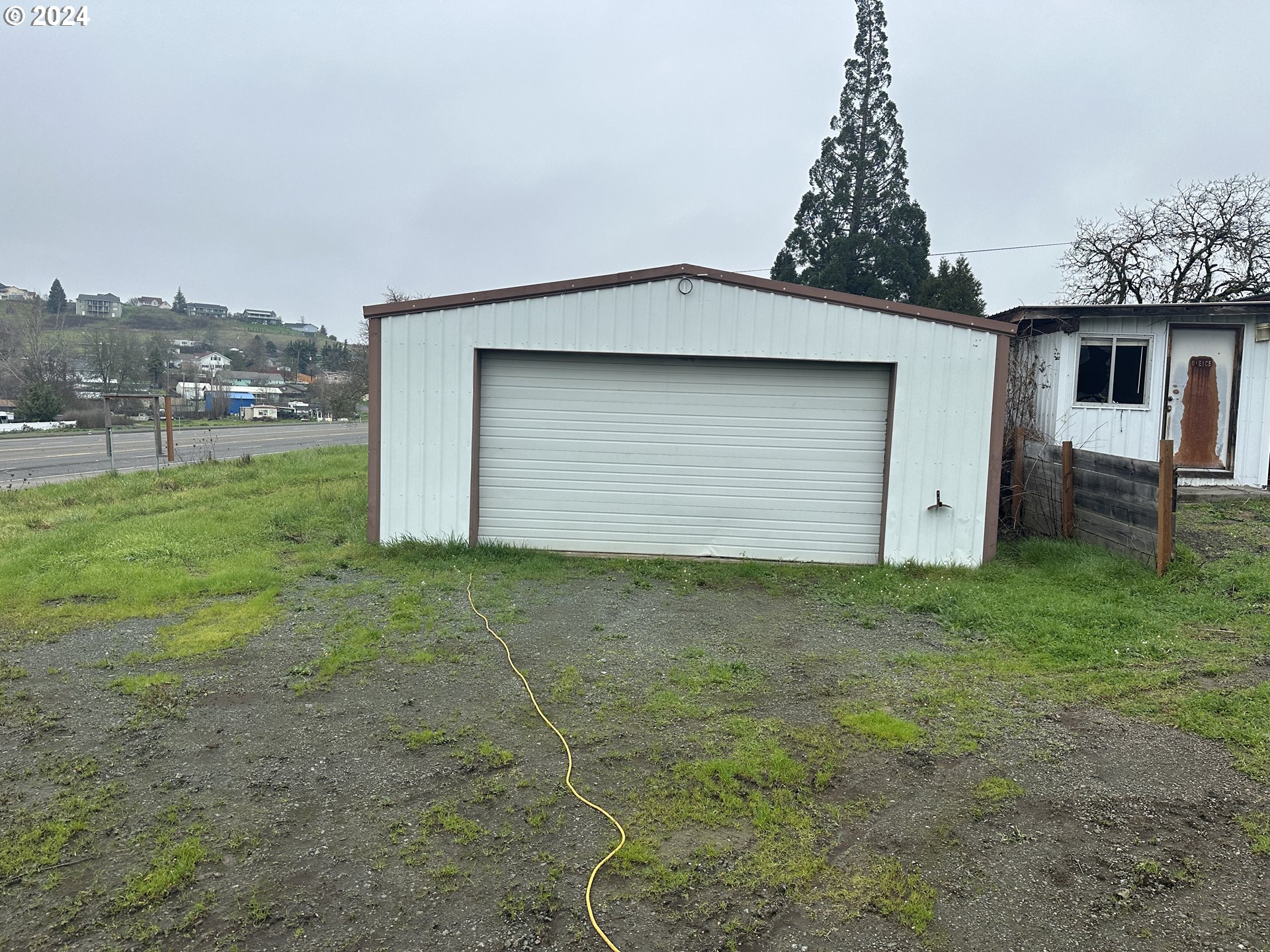 5114 Southwest Grange Road Roseburg, OR 97471 - Photo 10 of 11 a front view of a house with garden