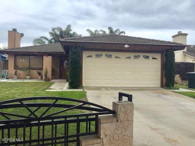 310 Fairbourne Place Oxnard, CA 93033 - Photo 1 of 7 a front view of a house with garden