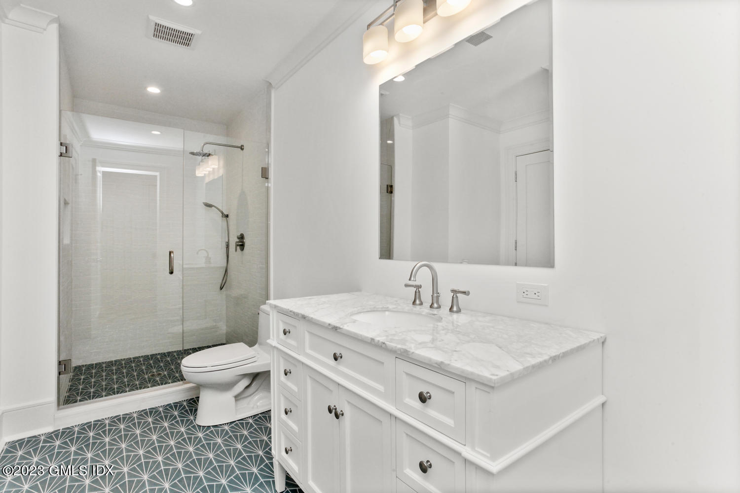 4 Ford Lane Old Greenwich, CT 06870 - Photo 30 of 43 a bathroom with a sink a toilet a shower and a mirror