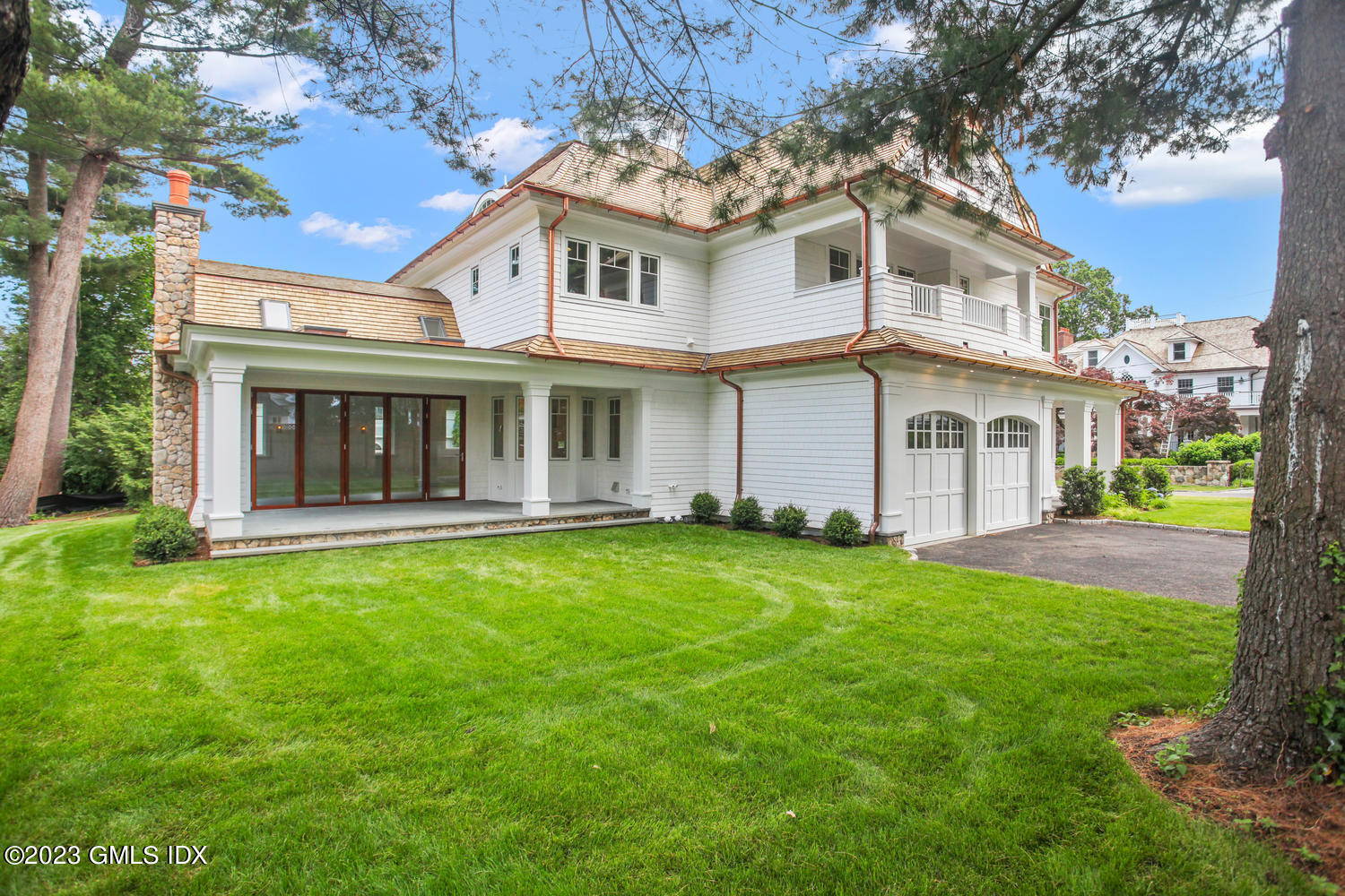 4 Ford Lane Old Greenwich, CT 06870 - Photo 35 of 43 a view of an house with backyard and garden