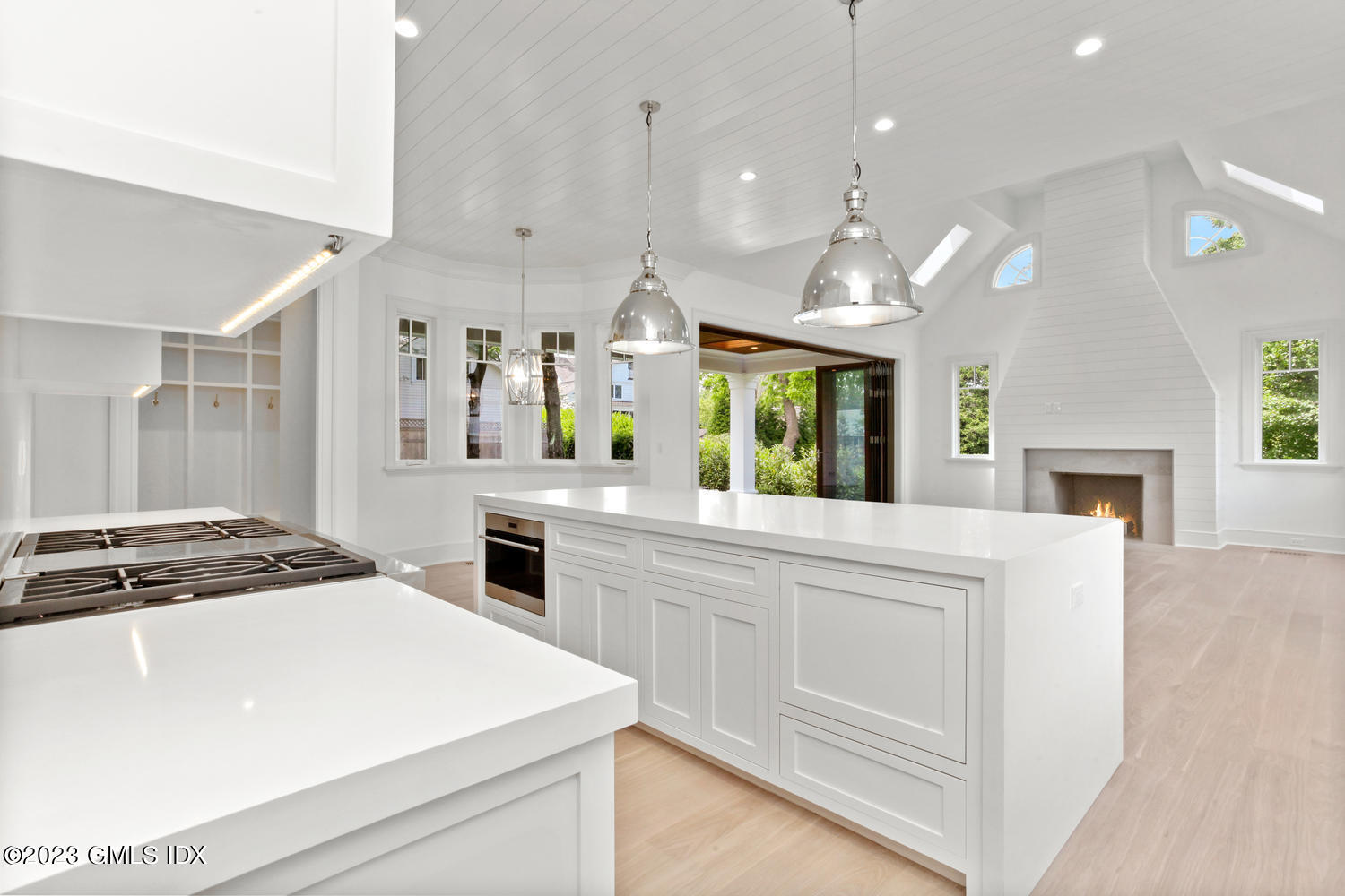 4 Ford Lane Old Greenwich, CT 06870 - Photo 10 of 43 a kitchen with kitchen island a stove a sink and a refrigerator