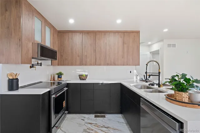 a kitchen with a sink and cabinets