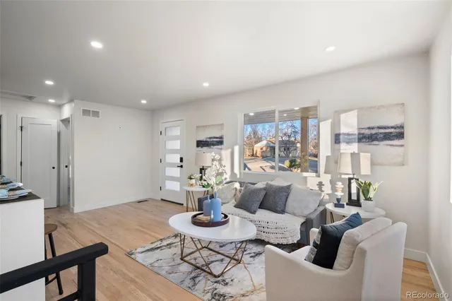 a living room with furniture and a table