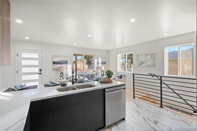 a kitchen with sink and window