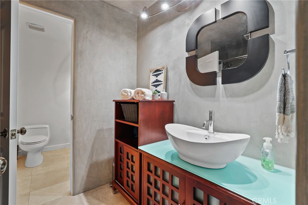 1862 Derby Drive North Tustin, CA 92705 - Photo 18 of 52 a bathroom with a toilet and a mirror