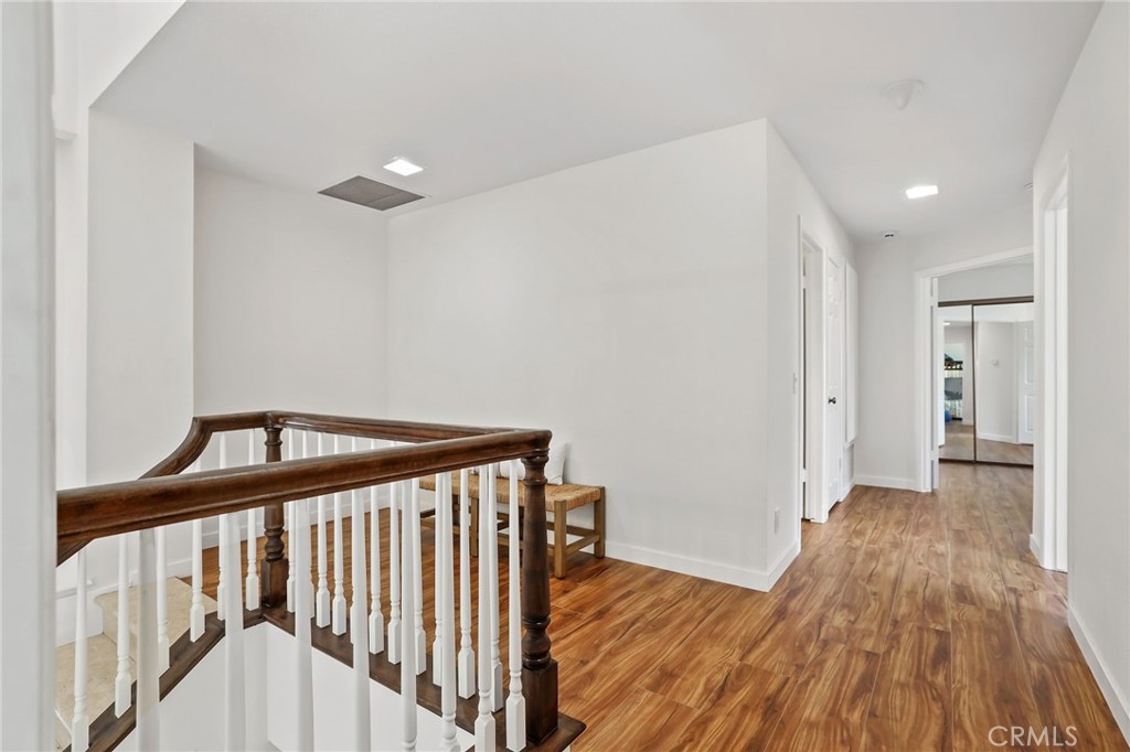 1862 Derby Drive North Tustin, CA 92705 - Photo 34 of 52 a view of a hallway with wooden floor and stairs