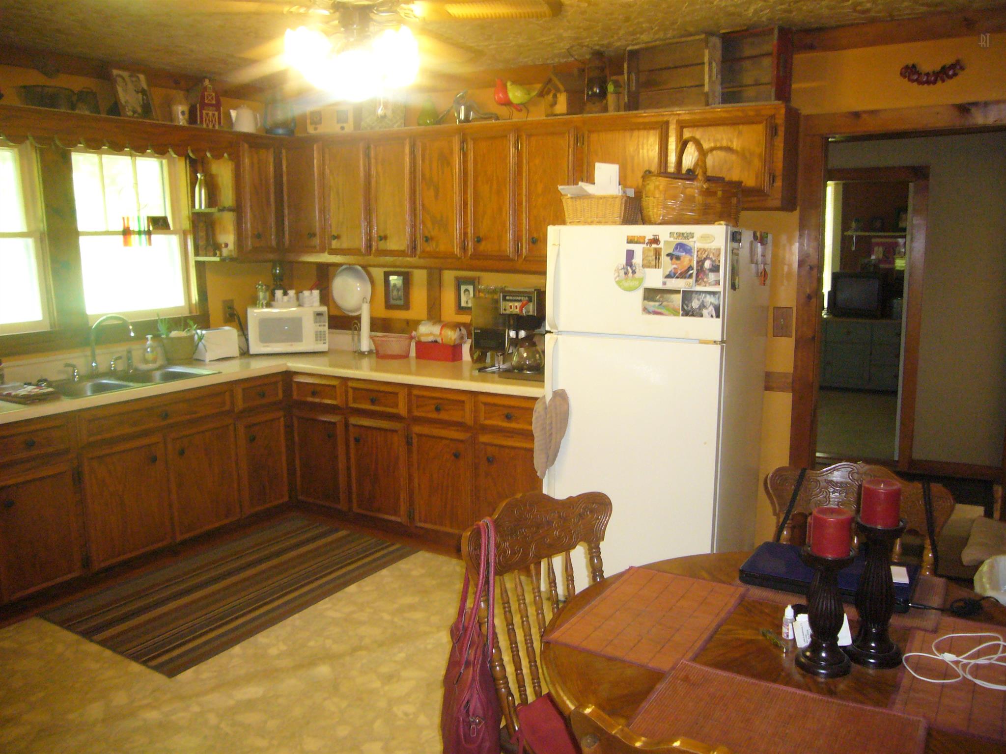 1005 North Springs Road Red Boiling Springs, TN 37150 - Photo 5 of 20 a kitchen with a sink cabinets and window
