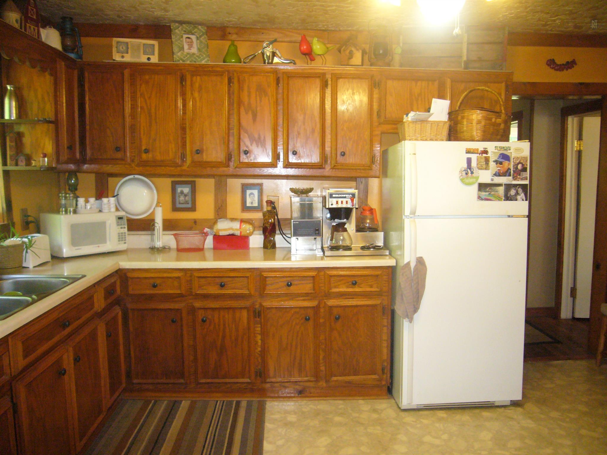 1005 North Springs Road Red Boiling Springs, TN 37150 - Photo 6 of 20 a kitchen with a sink refrigerator and cabinets