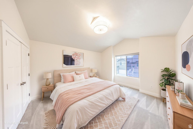 2169 Orchard Pines Loop East Bountiful, UT 84010 - Photo 20 of 32 Carpeted room featuring a vaulted ceiling and a rectangular window