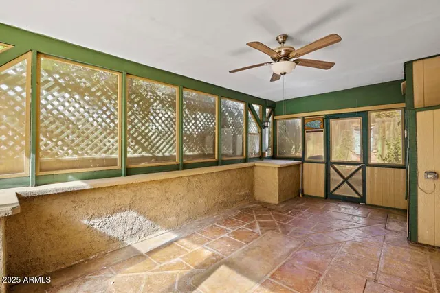 a view of a kitchen with a sink and wooden floor