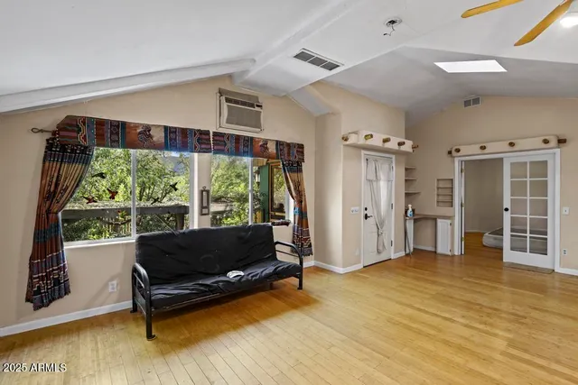 a living room with furniture and a yard