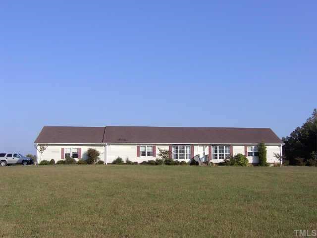 FRONT VIEW OF HOME WITH LARGE FRONT YARD