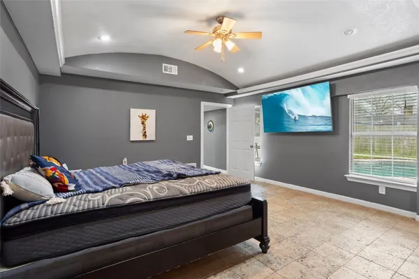 a bedroom with a bed and dresser