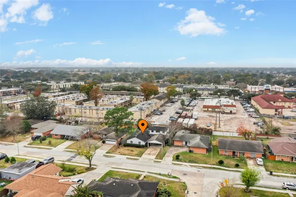 an aerial view of residential houses with outdoor space