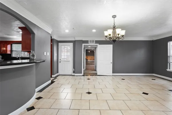 a view of a hallway with a chandelier