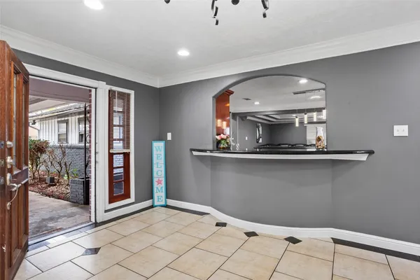 a living room with a mirror