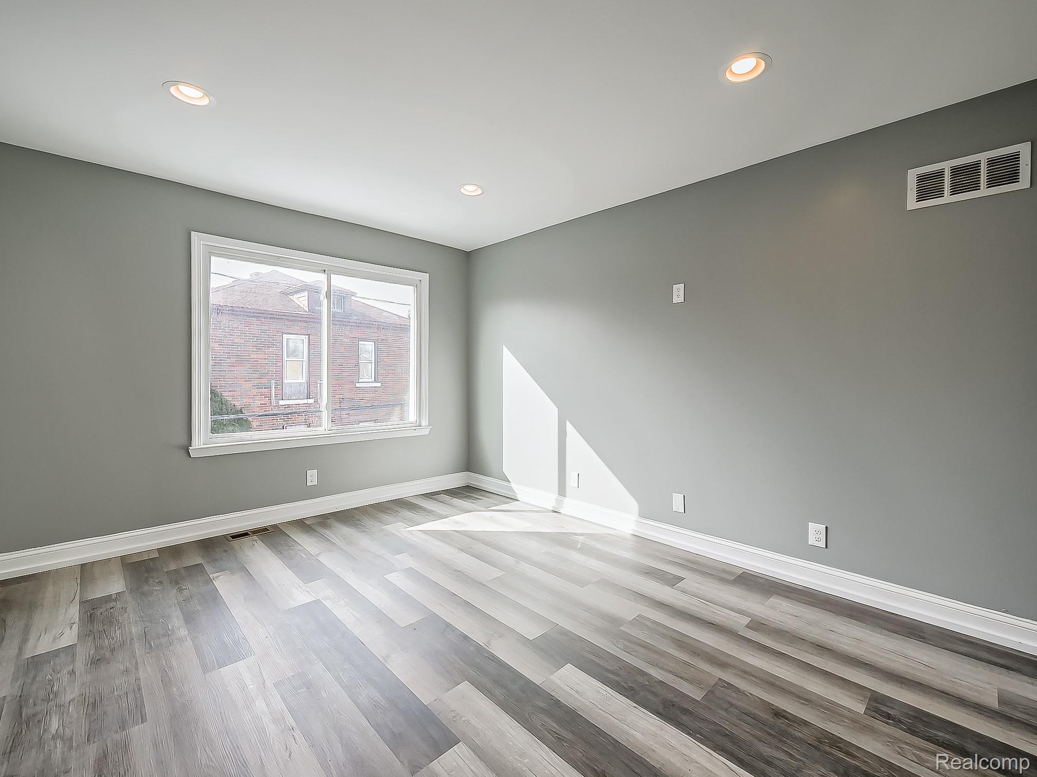 13 Mohawk Road Pontiac, MI 48341 - Photo 17 of 24 Empty room with light wood-type flooring and recessed lighting