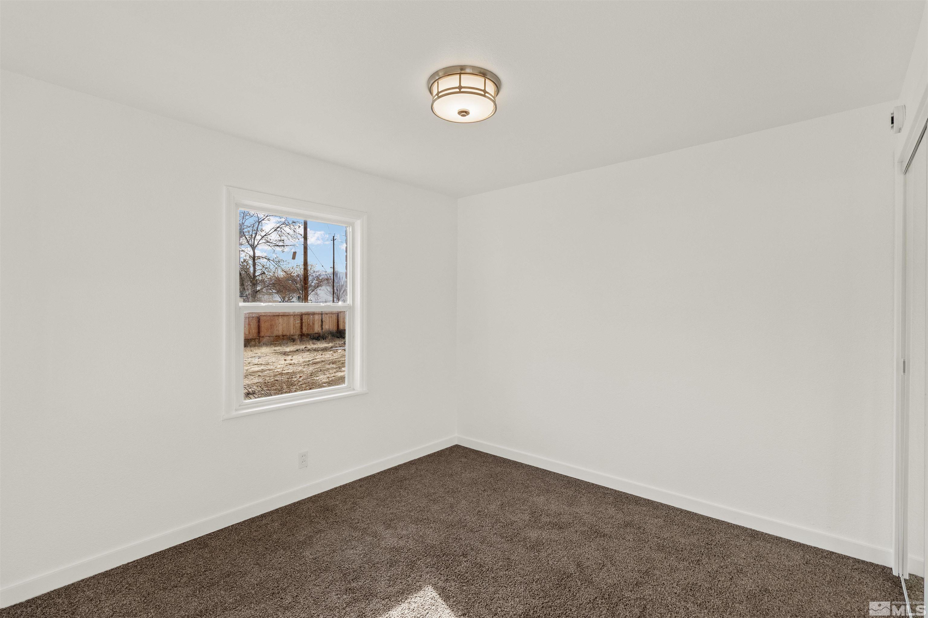 464 Cedar Street Reno, NV 89512 - Photo 12 of 40 a view of an empty room with a window