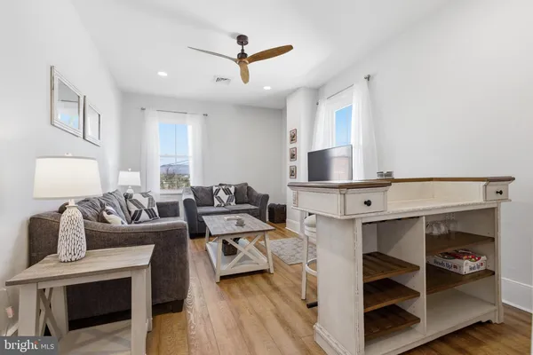 a living room with furniture rug and window
