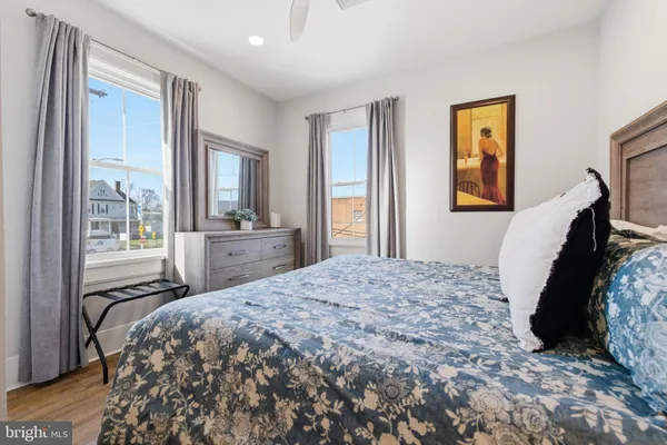 a bedroom with a bed and a night stand