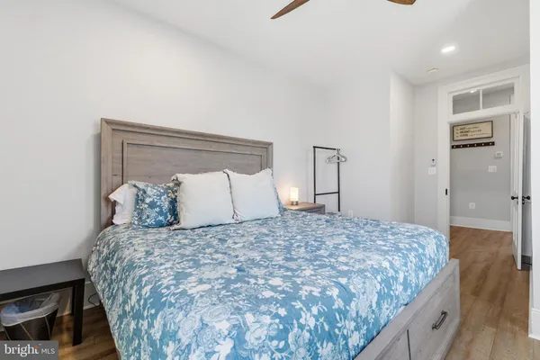 a bedroom with a bed and a dresser