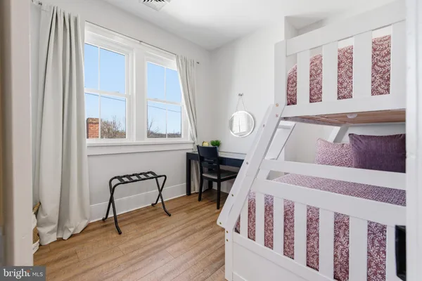 a bedroom with furniture and a bed