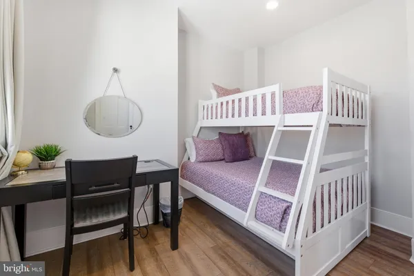 a view of a room with rack on the wall and a window