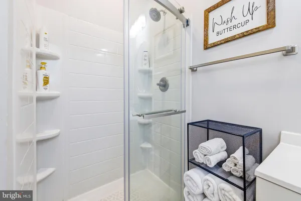 a bedroom with a bed and a view of bathroom