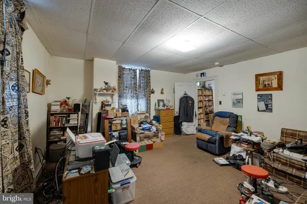 a room with furniture and a flat screen tv