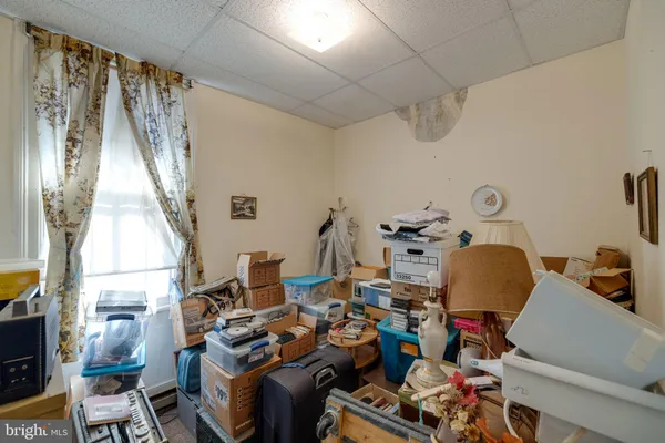a bedroom with furniture and a gym equipment